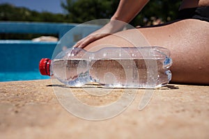 Bottle of water on poolside