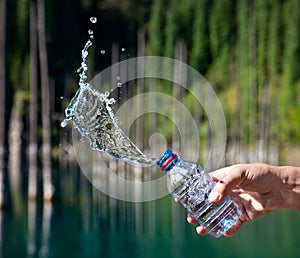 Bottle of water with splashes