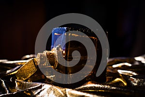 Bottle of wet perfume