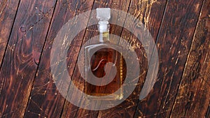 Bottle of whiskey on wooden table