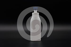 Bottle white cap blue liquid photo
