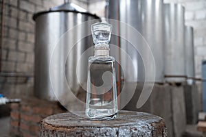 Bottle of white tequila made in the factory. photo