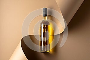 Bottle of white wine on a beige background