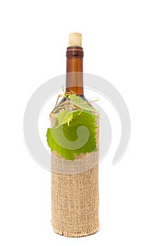 Bottle of White Wine in Sackcloth photo