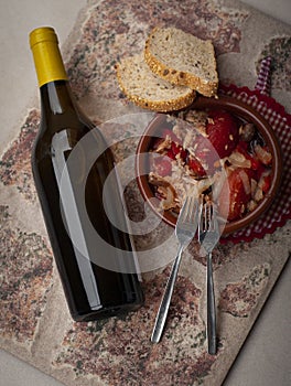 A bottle of white wine with salad photo
