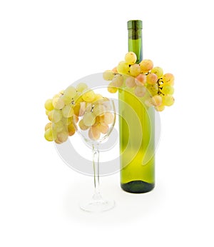 Bottle of white wine and white grapes