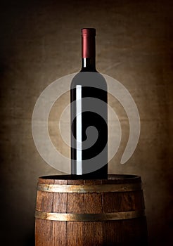 Bottle of wine on a barrel
