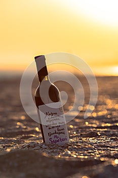 A bottle of wine on the Black Sea coast at sunset.