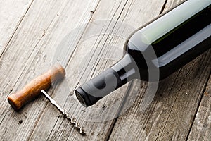 Bottle of wine and corkscrew