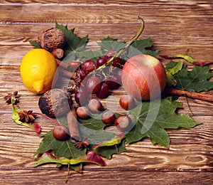 Bottle of wine, glass, leaves, wooden