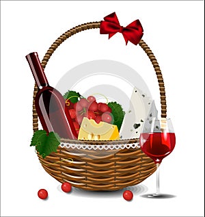 A bottle of wine, grapes and cheese in a wicker basket.