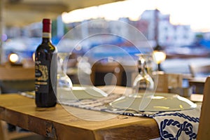 Bottle of wine with pictureque view of Kyrenia harbour in Cyprus