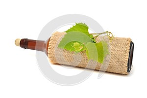 Bottle of Wine in Sackcloth with Grapevine