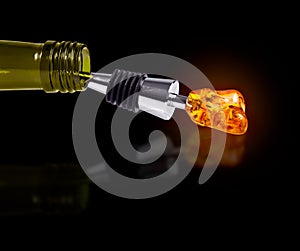 Bottle of Wine with a Stopper from Amber isolated on black background