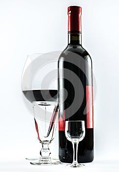 A bottle of wine and three glasses - composition