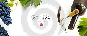 Bottle of wine with wineglass, corkscrew and bunch of grapes on a white background. Panoramic top view with space for text