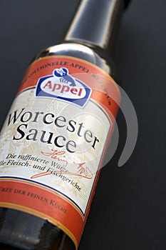 A bottle of Worcester sauce by Appel on black background
