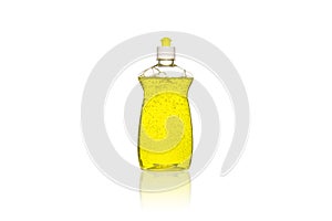 Bottle of yellow dish washing liquid with bubbles isolated white background