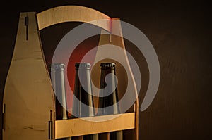 bottles of beer in a wooden box/ bottles of beer in a wooden box. selective focus and copyspace