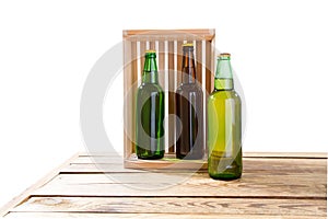 Bottles of beer on wooden table isolated on white background, glass bottles mock up, different beer bottles, empty mockup