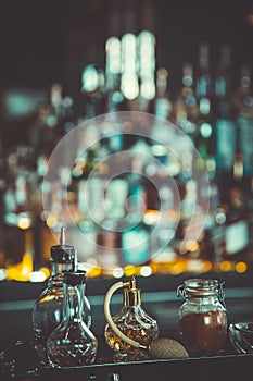 Bottles with Bitters and infusions on bar counter