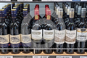 Bottles of Cabernet Sauvignon wine stand on a shelf in duty free shop airport in Muscat, Oman