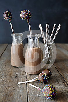 Bottles of chocolate milk with cake pops