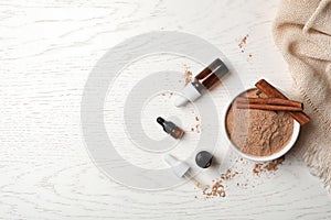 Bottles with cinnamon oil, powder and sticks