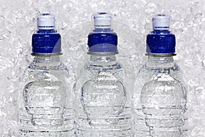 Bottles of cold mineral water on crushed ice