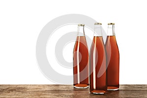 Bottles of delicious kvass on wooden table