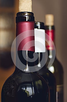 Bottles with delicious wine, closeup. Professional sommelier