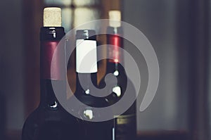 Bottles with delicious wine, closeup. Toned photograph