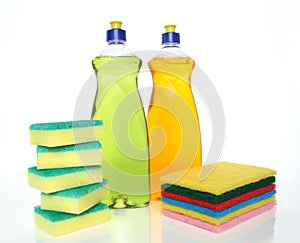 Bottles of dishwashing liquid and sponges