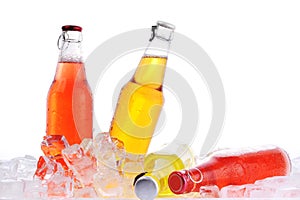 Bottles with drink in ice