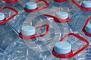 Bottles with drinking water. 5 liter bottles. Selective focus