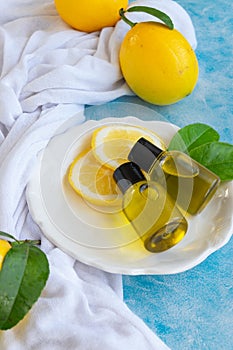 Bottles with essential lemon oil. Healthy natural beauty treatment