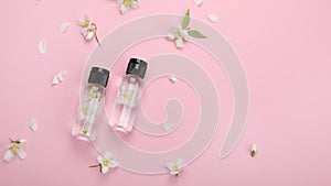 Bottles of essential oil with jasmine flowers photo