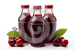 Bottles of fresh cherry juice and cheries lie on a white background isolated