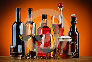 Bottles and glasses of alcohol drinks photo