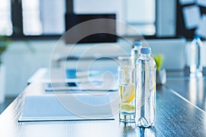 bottles and glasses with antioxidant drink for business meeting
