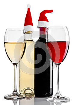 Bottles and glasses of red white wine santa hat