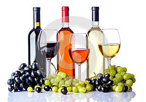 Bottles and glasses of wine with grapes