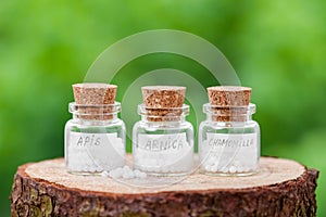 Bottles with homeopathy globules photo