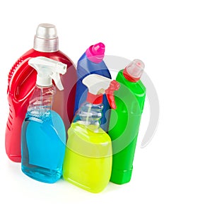 Bottles with household chemicals isolated on white . Free space for text