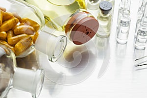 Bottles with liquid medicaments and capsules photo