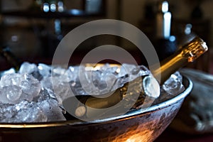 Bottles of luxury champagne in frape with ice. photo