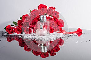 Bottles of male and female perfume on a background of red roses. GREETING BANNER. Cosmetics Presentation. Seasonal pre
