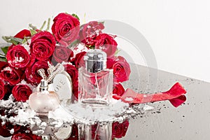 Bottles of male and female perfume, red roses, decorative hearts. Cosmetics Presentation.Gift for Valentine\'s Day