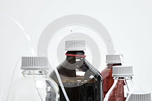 Bottles with mobile phase for high performance liquid chromatography. HPLC system for separation of organic compounds.
