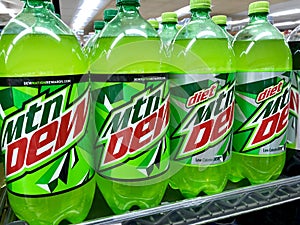 Bottles of Mountain Dew soda on shelf